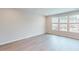 Open living area featuring modern wood floors, bright lighting, and large windows with natural light at 2313 Bay Minette Sta # 543, Apex, NC 27502