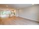 Bright and spacious open floorplan featuring modern hardwood floors flowing into the kitchen and dining area at 2313 Bay Minette Sta # 543, Apex, NC 27502