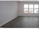 Bright living room featuring a large window and wood floors at 2313 Bay Minette Sta # 543, Apex, NC 27502