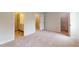 This main bedroom features a neutral color palette with attached ensuite and large closet at 2313 Bay Minette Sta # 543, Apex, NC 27502