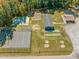 Aerial view of neighborhood amenities including tennis courts, playground, and covered areas at 251 Sequoia Dr, Louisburg, NC 27549