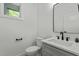Modern powder room with sleek vanity, black fixtures, and minimalist design for a clean and stylish look at 251 Sequoia Dr, Louisburg, NC 27549