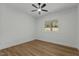 A bright bedroom with a ceiling fan and a view of the outdoors at 251 Sequoia Dr, Louisburg, NC 27549