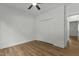 Neutral bedroom with a ceiling fan and closet doors with hard wood floors at 251 Sequoia Dr, Louisburg, NC 27549