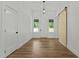 Bright entryway featuring wood floors, a sliding barn door, and natural light at 251 Sequoia Dr, Louisburg, NC 27549