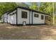 Exterior of home with white siding, black trim, screened-in porch, and stairs at 251 Sequoia Dr, Louisburg, NC 27549
