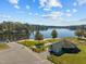 Aerial view showcasing lake with building, playground, and parking at 251 Sequoia Dr, Louisburg, NC 27549