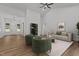 Bright living room with hardwood floors, modern furnishings, and lots of natural light at 251 Sequoia Dr, Louisburg, NC 27549