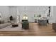 Inviting living space featuring an open layout, wood floors, and seamless access to the kitchen and dining area at 251 Sequoia Dr, Louisburg, NC 27549