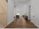 Open living space showcasing wood floors, modern lighting, and a seamless flow to the kitchen at 251 Sequoia Dr, Louisburg, NC 27549