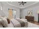 Spacious main bedroom boasts hardwood floors, barn door to bath, and modern decor for a peaceful retreat at 251 Sequoia Dr, Louisburg, NC 27549