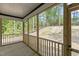 Screened in porch with views of surrounding trees and spacious yard at 251 Sequoia Dr, Louisburg, NC 27549