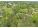 Beautiful aerial view of the neighborhood, surrounded by lush trees and greenery, and a golf course nearby at 2805 Chelsea Cir, Durham, NC 27707