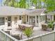 Spacious backyard deck with outdoor dining and seating, perfect for enjoying nature's tranquility at 2805 Chelsea Cir, Durham, NC 27707