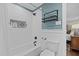 Bright bathroom features white subway tile and a decorative tiled niche in the shower at 2805 Chelsea Cir, Durham, NC 27707