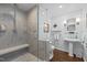 Modern bathroom with a glass shower, floating vanity, and warm neutral tones at 2805 Chelsea Cir, Durham, NC 27707