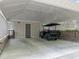 Well-maintained carport with ample space, showcasing a golf cart and detailed ceiling at 2805 Chelsea Cir, Durham, NC 27707