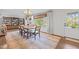 Formal dining room with stylish chandelier, and large window at 2805 Chelsea Cir, Durham, NC 27707
