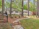 Charming home with a stone walkway and a well-maintained lawn surrounded by mature trees at 2805 Chelsea Cir, Durham, NC 27707