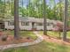 Ranch home with stone walkway, mature trees, and manicured lawn for great curb appeal at 2805 Chelsea Cir, Durham, NC 27707