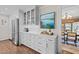 Bright kitchen featuring white cabinetry, stainless steel appliances, and an adjacent dining area at 2805 Chelsea Cir, Durham, NC 27707