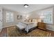 Comfortable main bedroom showcasing a large bed, neutral walls, and shuttered windows at 2805 Chelsea Cir, Durham, NC 27707