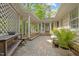 Outdoor patio featuring stone pavers, lush greenery, and a cozy seating area at 2805 Chelsea Cir, Durham, NC 27707