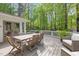 Inviting outdoor patio with wooden dining set and comfortable seating, perfect for entertaining at 2805 Chelsea Cir, Durham, NC 27707