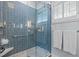 Elegant bathroom features blue tile and glass enclosed shower with shower head at 2805 Chelsea Cir, Durham, NC 27707