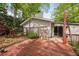 Back exterior view features wooden deck, neutral siding, mature trees, and natural light at 2852 Rue Sans Famille, Raleigh, NC 27607