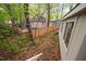 A fenced backyard features a lush, wooded area, offering a private and serene outdoor space at 2852 Rue Sans Famille, Raleigh, NC 27607