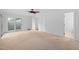 Bright bedroom with neutral carpet, white walls, and ample closet space at 2852 Rue Sans Famille, Raleigh, NC 27607