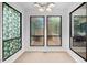 Bright dining area featuring unique stained glass and modern lighting fixtures for a touch of elegance at 2852 Rue Sans Famille, Raleigh, NC 27607