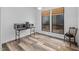 Bright dining area with modern appliances on a table, accented by windows with natural shades and a wooden chair at 2852 Rue Sans Famille, Raleigh, NC 27607