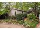 Landscaped home exterior with a mailbox and address number displayed, showing the yard's well-kept bushes and plants at 2852 Rue Sans Famille, Raleigh, NC 27607