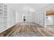 Spacious living room featuring wood floors, built-in shelving, and a large window for plenty of natural light at 2852 Rue Sans Famille, Raleigh, NC 27607