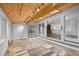 Spacious sunroom with wood-paneled ceilings, skylights, and access to the main house through a large doorway at 2852 Rue Sans Famille, Raleigh, NC 27607