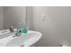 Bathroom sink with chrome faucet and soap dispenser, and mirror on the wall at 292 Joshua Glen Ln, Cary, NC 27519