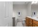 Bathroom featuring a wood vanity, white cabinets, and bath tub at 292 Joshua Glen Ln, Cary, NC 27519