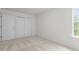 A bright bedroom with large closet and neutral carpet at 292 Joshua Glen Ln, Cary, NC 27519