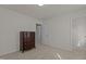 A carpeted bedroom with white walls, and a brown wood dresser at 292 Joshua Glen Ln, Cary, NC 27519