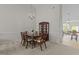 Elegant dining room with a wooden table set, chandelier lighting, and open access to the living spaces at 292 Joshua Glen Ln, Cary, NC 27519