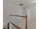 A carpeted hallway features a wooden railing, white walls and doors to other rooms at 292 Joshua Glen Ln, Cary, NC 27519