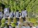 An aerial view showcasing well-maintained homes and mature trees at 301 Marsh Landing Dr, Holly Springs, NC 27540