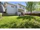 Charming home exterior with a lush green lawn, wooden fence, and inviting back deck at 301 Marsh Landing Dr, Holly Springs, NC 27540
