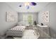 Bright bedroom with a cozy bed, desk area, and contemporary decor at 301 Marsh Landing Dr, Holly Springs, NC 27540