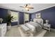 Virtually staged primary bedroom features plush carpeting, neutral tones, and natural light, perfect for relaxation at 301 Marsh Landing Dr, Holly Springs, NC 27540