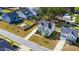 Aerial view highlights the home, landscaped front yard, driveway, and surrounding neighborhood streetscape at 3037 Freeman Farm Way, Rolesville, NC 27571
