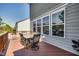 Cozy back deck with outdoor seating area, perfect for enjoying the surrounding natural landscape at 3037 Freeman Farm Way, Rolesville, NC 27571