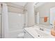 Bright bathroom with a white vanity, a large mirror, and a shower with a white curtain at 3037 Freeman Farm Way, Rolesville, NC 27571